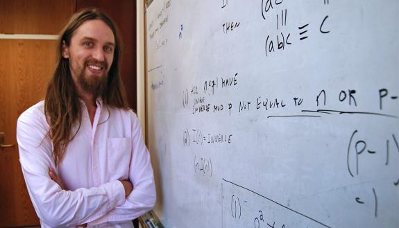 Matt Junge in front of a whiteboard.