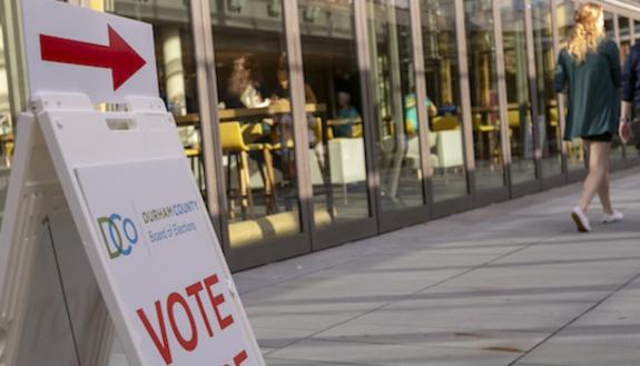 People line up to vote on campus.