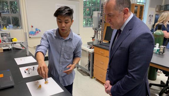 Justin Jorge (left) , a Duke PhD student in biology, speaks with Gabriel Camarillo, under secretary of the Army, about research conducted in the lab led by Professor Sheila Patek. (Photo courtesy Kamil Sztalkoper, US Army)