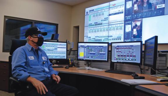 Paul Schuler, control room operator at Chiller Plant No. 2, keeps a close eye on displays showing real-time data from the many pumps, chillers and boilers that make up Duke’s chilled water and steam systems. Photo by Stephen Schramm.