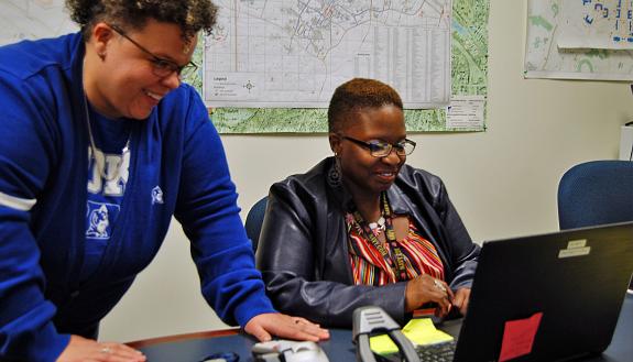 Duke Disability System's Ashley Robbins, left, works with Marquita Mangum of the Foundational Skills Program. Photo by Stephen Schramm.