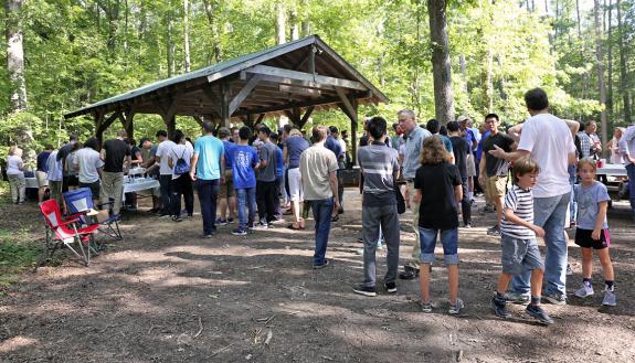 Guests attend the Duke Department of Physics’ annual welcome picnic in Duke Forest. Photo courtesy of the Department of Physics.