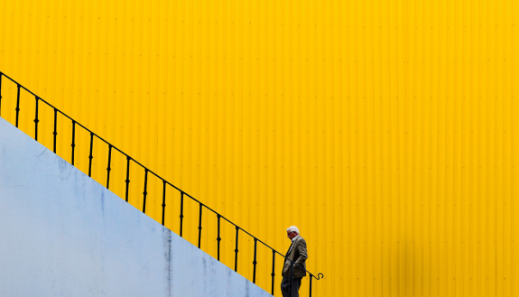 graphic of person walking large staircase