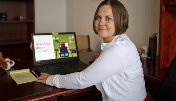 Sarah Hamblet sticks to a visual template and keeps her large when working on PowerPoints. Photo by Erin Hull.