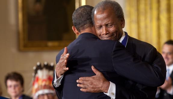 Sidney Poitier is hugged by President Barak Obama at the White House.
