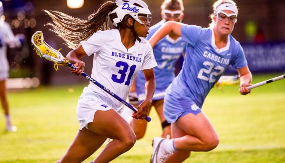Staggers playing lacrosse