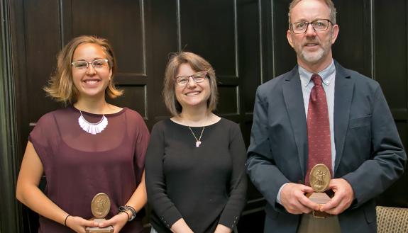 Sullivan Award winners Lauren Harper, left, and Rick Hoyle, right, received their awards from Provost Sally Kornbluth, center, on Friday.