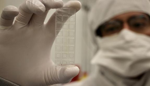 Cassio Fontes demonstrates a prototype of the D4 assay, which might be used to quickly test for COVID antigens, using blood drops and a hand-held scanner.