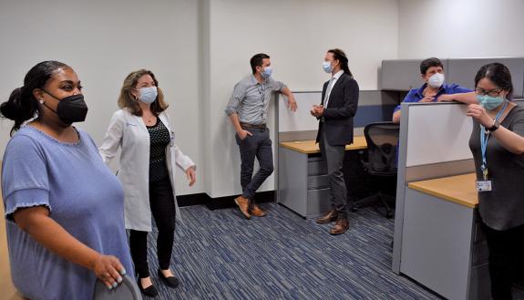 Duke Aging Center Director Dr. Heather Whitson, second from left, shows off the center's new shared workspace. Photo by Stephen Schramm.