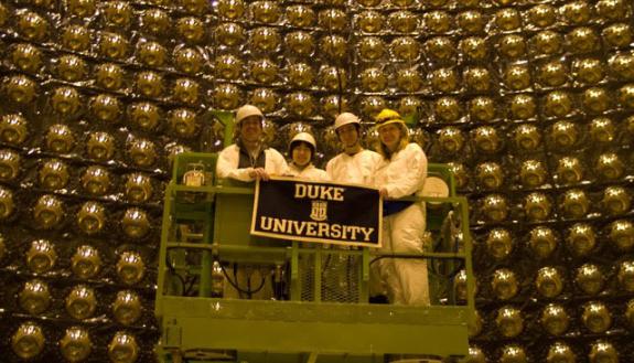 Chris Walter (left) and his Duke physics collaborator and partner, Kate Scholberg (right), on a lift inside the Super-Kamiokande neutrino detector.