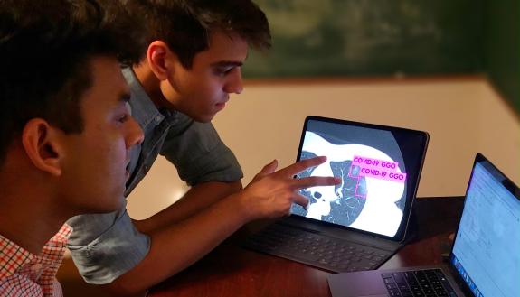 Duke students Anmol Warman ’22 and Pranav Warman ’20 have trained a computer to spot the telltale signs of COVID-19 in lung scans and rule out other infections that look similar to the human eye.