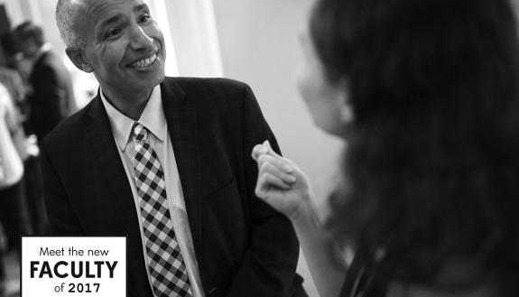 Abbas Benmamoun, meeting with a faculty member at a reception this week, says he appreciates the approach Duke is taking linking diversity to excellence. Photo by Chris Hildreth/Duke Photography