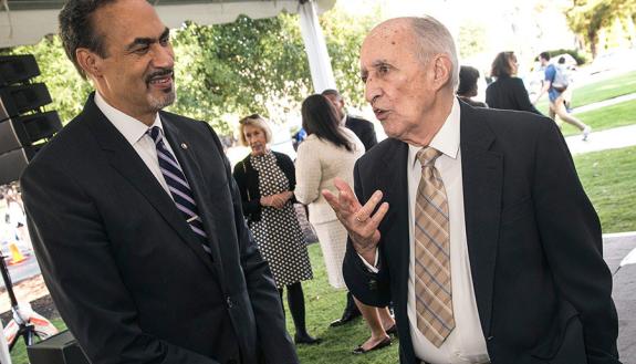 At a 2016 ceremony, Phil Freelon, left, talks with Julian Abele Jr., son of the architect who designed much of West Campus.