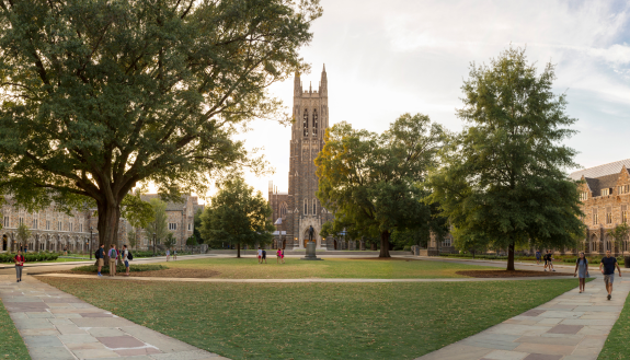 Students and others walk on Abele quad, named after the Black architect who designed much of West Campus.