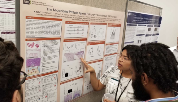 Alma Solis presenting her research as a National Institutes of Health Postbaccalaureate Intramural Research Training Award Fellow at the NIH campus in Bethesda, Md.