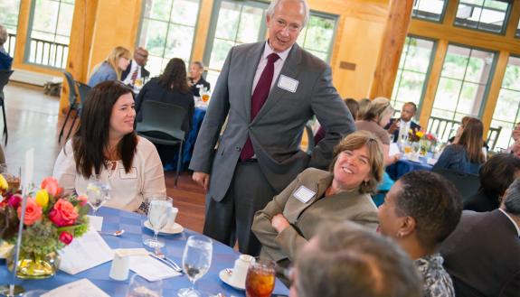 Duke President Richard H. Brodhead talks with Teamwork and Diversity Award recipients at a luncheon held Nov. 1 in Sarah P. Duke Gardens' Doris Duke Center.