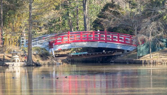 The renovated Duke Gardens bridge gets painted