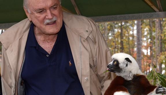 John Cleese with Aemilia the sifaka