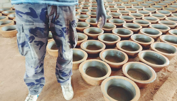 Kettle-like "rocket" stoves are produced in Senegal using local labor and materials. Photo by Faraz Usmani