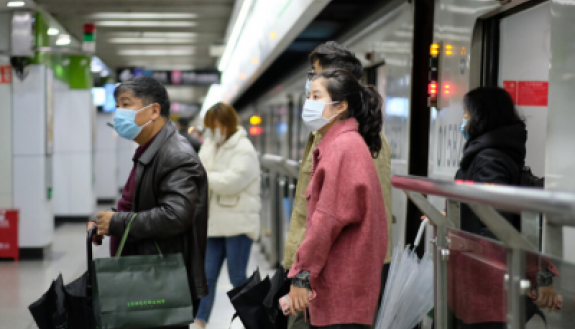 Masked Chinese residents in subway station