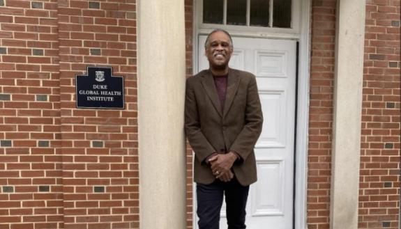 Alonzo Felder in front of the DGHI office