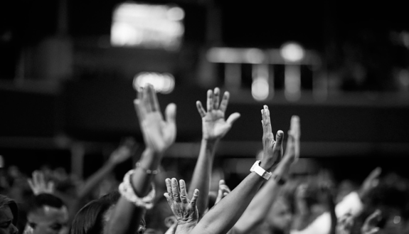 hands raised in a church service