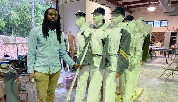 Stephen Hayes with the "Boundless" sculpture.