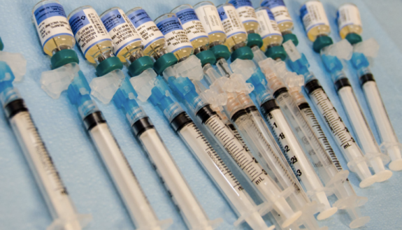 A common example of needles and vials containing immunization products (Creative Commons).