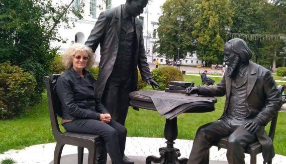 The author in Tomsk, Russia with a statue of the founders of Tomsk State University.