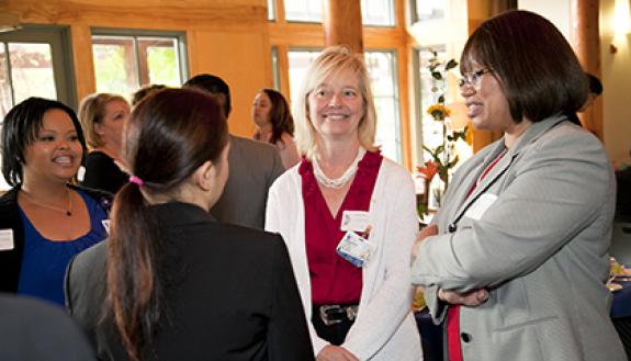 Duke staff members mingle during a 2014 Blue Ribbon Awards recognition luncheon at the Doris Duke Center at Sarah P. Duke Gardens. Photo by Duke Photography