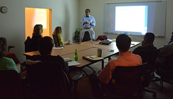 Benjamin Reese, center, vice president of the Office for Institutional Equity, leads a workshop in Smith Warehouse about unconcious bias.