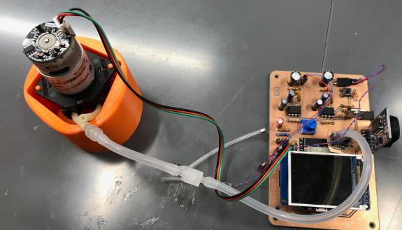 An early generation prototype of the tympanometer device that can modulate pressure, generate sound, and measure the reflected sound from the tympanic membrane
