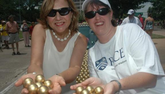 Naomi Halas (left) and Jennifer West at Houston's 2012 Art Car Parade. Rice's parade entry honored the engineering researchers for their invention of AuroLase Therapy, a cancer treatment that uses gold nanoparticles to destroy cancer without damaging heal