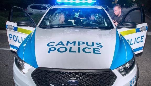 Participants in the 2019 Citizen's Police Academy take part in a simulated traffic stop. Photo by Chris Hildreth.