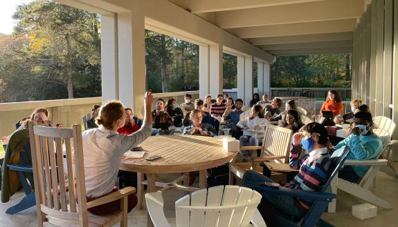 Jonathan Phillips, director of the James E. Rogers Energy Access Project, leads a Policy Perspectives session with students outside Gross Hall in November 2021. 