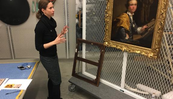 Molly Boarati in the Nasher Museum basement with the painting