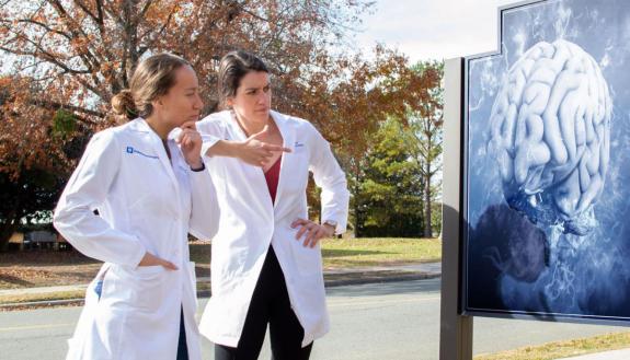 Jessica Waibl Polania (left) and Selena Lorrey are looking for ways to use the body's own immune system to target and treat glioblastoma. (Photo illustration)