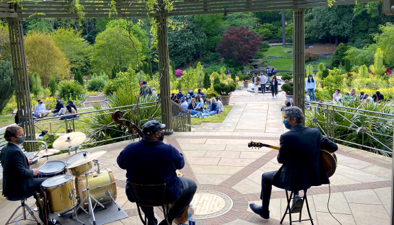 Seniors gather by the Cindy Brodhead Pergola in Duke Gardens to hear jazz music Thursday afternoon. Photo by Jared Lazarus