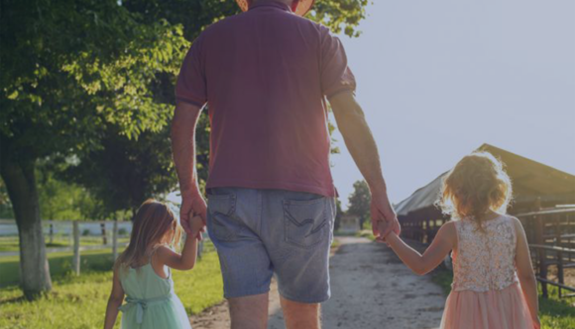 image of senior walking with two young children