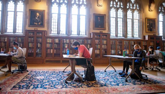 Wearing masks and physically distanced, students study in the Gothic Reading Room of Perkins Library. Photo by Jared Lazarus, Duke University Communications.