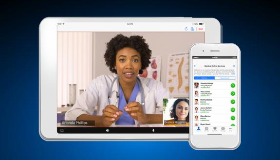A doctor and patient communicating on a tablet.