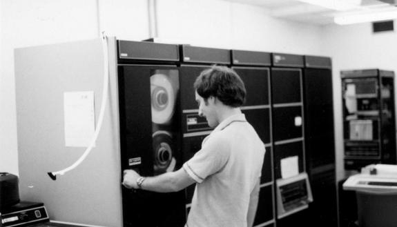 Jim Ellis mounting a magtape on the Duke CS department minicomputer; photo courtesy of Tom Truscott