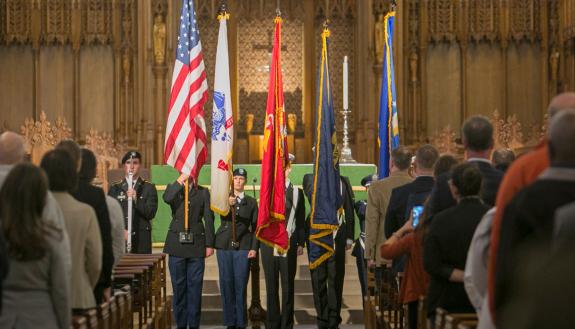 Members of Duke's ROTC programs hold flags aloft Monday as Duke's annual Veterans Day commemoration began. Photo by Jared Lazarus.