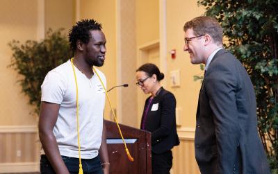 Mark Dudley and a graduating student.