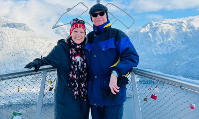 Cara Gambill with her father, Alan Gambill, pose on a walk to a salt mine overlooking Hallstatt Lake near Salzburg, Germany. in December 2023.