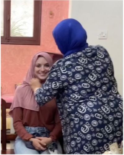 Anna Rogacki getting fitted for a hijab by her host family.